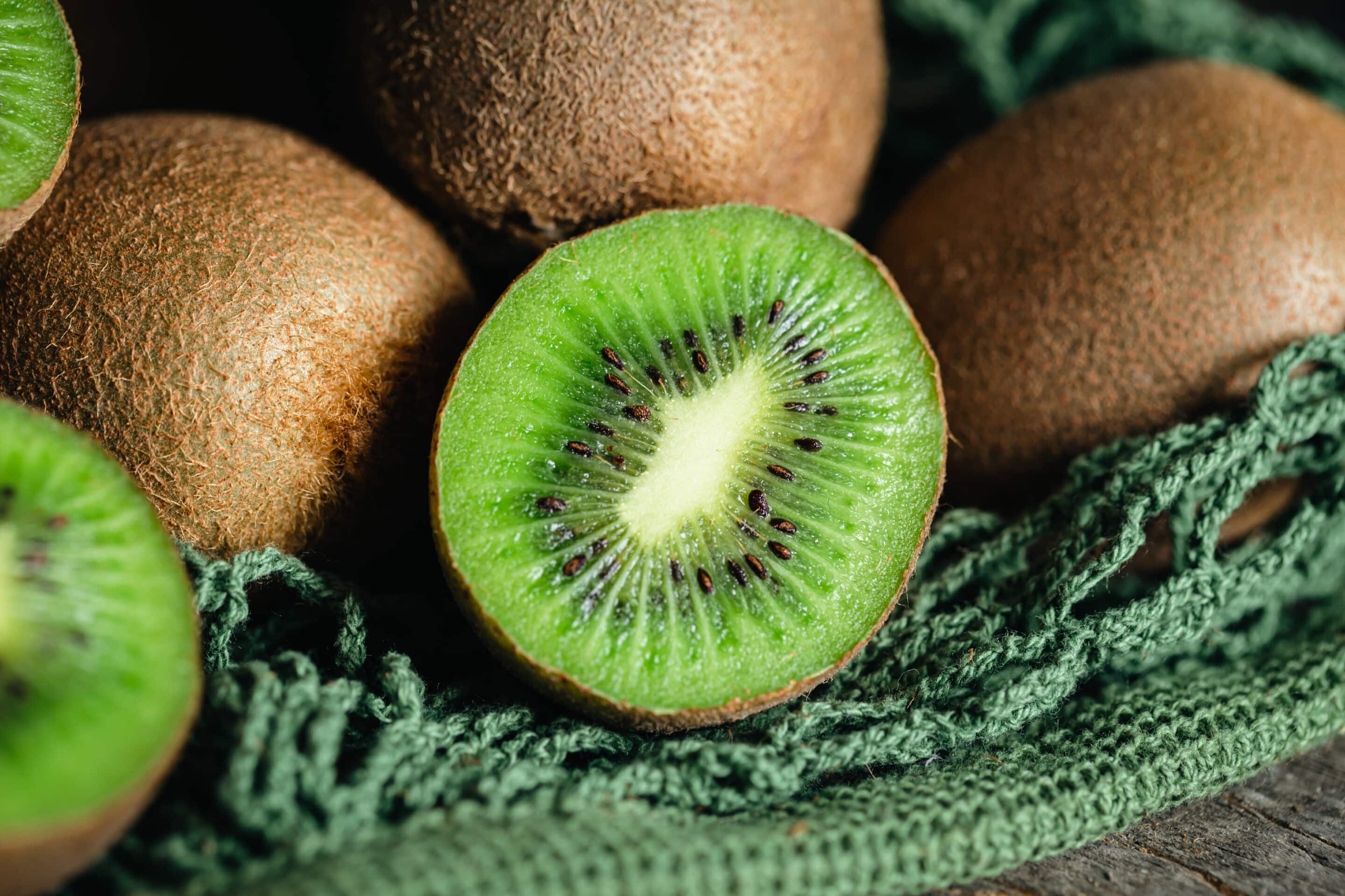 kiwi fruits in a mesh bag, close up.